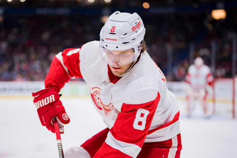 Feb 13, 2023; Vancouver, British Columbia, CAN; Detroit Red Wings defenseman Ben Chiarot (8) gathers the puck against the Vancouver Canucks in the third period at Rogers Arena. Red Wings won 6-1. Mandatory Credit: Bob Frid-USA TODAY Sports