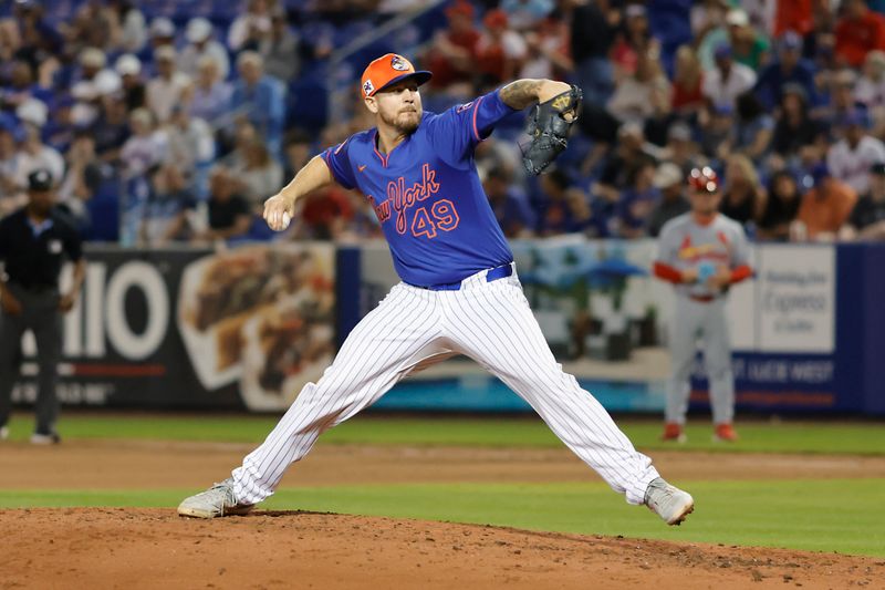 Mar 14, 2025; Port St. Lucie, Florida, USA;  New York Mets pitcher Chris Devenski (49) throws a pitch during the seventh inning against the St. Louis Cardinals at Clover Park. Mandatory Credit: Reinhold Matay-Imagn Images