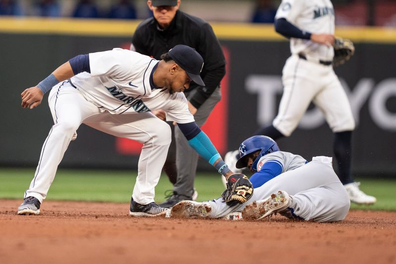 May 13, 2024; Seattle, Washington, USA; Kansas City Royals centerfielder Dairon Blanco (44) steals second base ahead of a tag by Seattle Mariners second baseman Jorge Polanco (7) during the second inning at T-Mobile Park. Mandatory Credit: Stephen Brashear-USA TODAY Sports