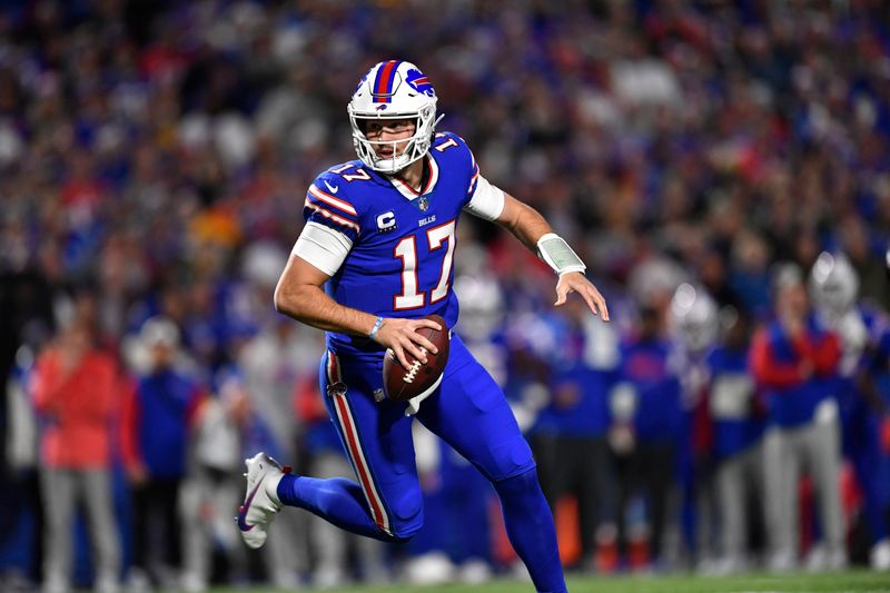 Buffalo Bills quarterback Josh Allen (17) scrambles during the first half of an NFL football game against the Green Bay Packers Sunday, Oct. 30, 2022, in Orchard Park. (AP Photo/Adrian Kraus)