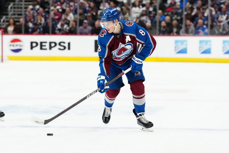 Dec 11, 2023; Denver, Colorado, USA; Colorado Avalanche defenseman Cale Makar (8) controls the puck in the second period against the Calgary Flames at Ball Arena. Mandatory Credit: Ron Chenoy-USA TODAY Sports