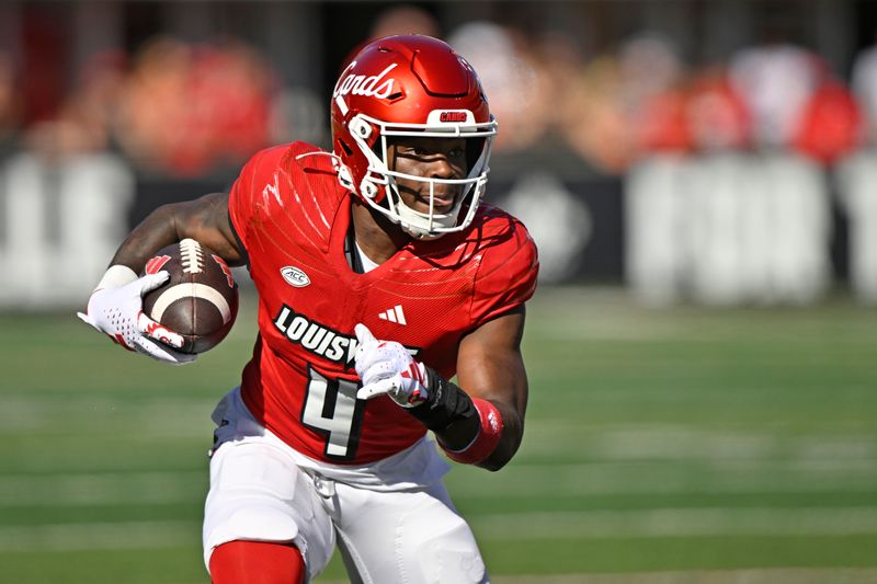 Sep 23, 2023; Louisville, Kentucky, USA;  Louisville Cardinals running back Maurice Turner (4) runs the ball against the Boston College Eagles during the first half at L&N Federal Credit Union Stadium. Louisville defeated Boston College 56-28. Mandatory Credit: Jamie Rhodes-USA TODAY Sports