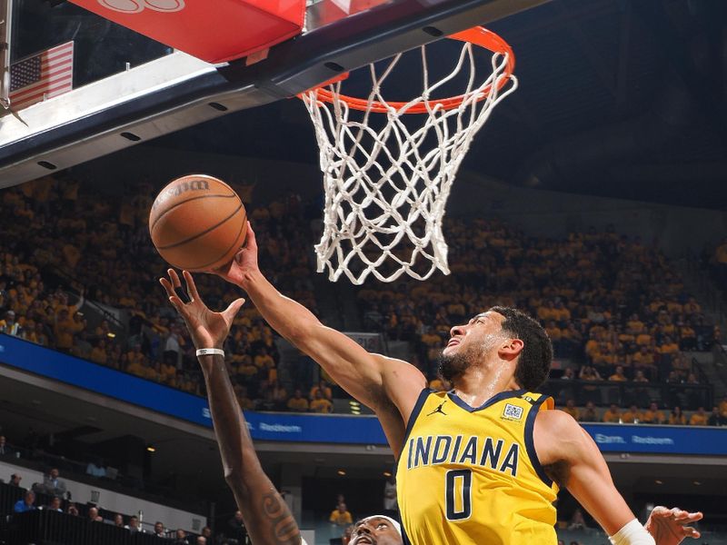 INDIANAPOLIS, IN - APRIL 26:  Tyrese Haliburton #0 of the Indiana Pacers and Bobby Portis #9 of the Milwaukee Bucks gbattle for a rebound during Round 1 Game 3 of the 2024 NBA Playoffs on April 26, 2024 at Gainbridge Fieldhouse in Indianapolis, Indiana. NOTE TO USER: User expressly acknowledges and agrees that, by downloading and or using this Photograph, user is consenting to the terms and conditions of the Getty Images License Agreement. Mandatory Copyright Notice: Copyright 2024 NBAE (Photo by Ron Hoskins/NBAE via Getty Images)