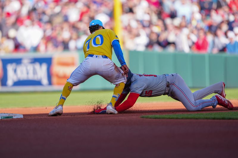 May 11, 2024; Boston, Massachusetts, USA; Boston Red Sox second baseman David Hamilton (70) tags out Washington Nationals right fielder Victor Robles (16) after he was picked off first base during the eighth inning at Fenway Park. Mandatory Credit: Gregory Fisher-USA TODAY Sports