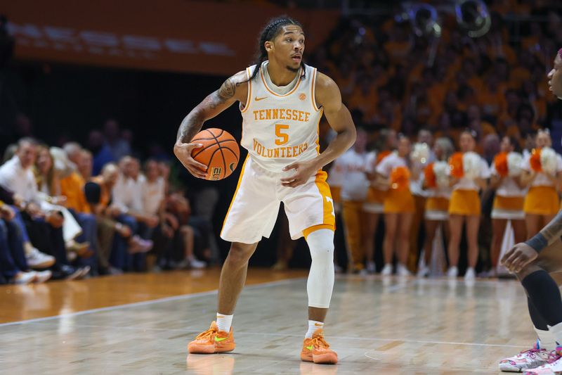 Feb 24, 2024; Knoxville, Tennessee, USA; Tennessee Volunteers guard Zakai Zeigler (5) brings the ball up court against the Texas A&M Aggies during the first half at Thompson-Boling Arena at Food City Center. Mandatory Credit: Randy Sartin-USA TODAY Sports