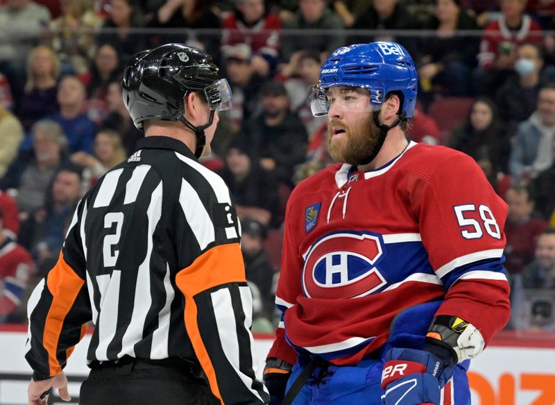 Jan 25, 2024; Montreal, Quebec, CAN; Montreal Canadiens defenseman David Savard (58) talks with referee Jon McIsaac (2) during the second period of the game against the New York Islanders at the Bell Centre. Mandatory Credit: Eric Bolte-USA TODAY Sports