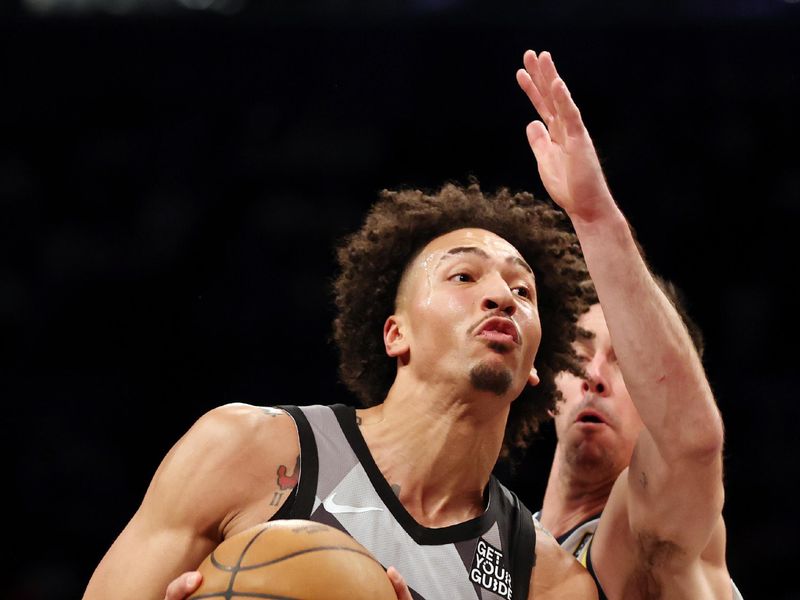 NEW YORK, NEW YORK - DECEMBER 04: Jalen Wilson #22 of the Brooklyn Nets goes to the basket as T.J. McConnell #9 of the Indiana Pacers defends during the second half at Barclays Center on December 04, 2024 in the Brooklyn borough of New York City. The Nets won 99-90. NOTE TO USER: User expressly acknowledges and agrees that, by downloading and or using this photograph, User is consenting to the terms and conditions of the Getty Images License Agreement. (Photo by Sarah Stier/Getty Images)