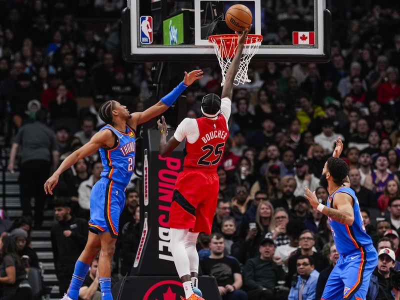 TORONTO, ON - DECEMBER 05: Chris Boucher #25 of the Toronto Raptors goes to the basket against Aaron Wiggins #21 of the Oklahoma City Thunder at Scotiabank Arena on December 5, 2024 in Toronto, Ontario, Canada. NOTE TO USER: User expressly acknowledges and agrees that, by downloading and/or using this Photograph, user is consenting to the terms and conditions of the Getty Images License Agreement. (Photo by Andrew Lahodynskyj/Getty Images)