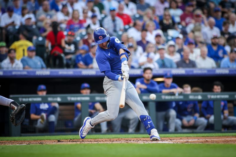 Sep 14, 2024; Denver, Colorado, USA; Chicago Cubs second base Nico Hoerner (2) bats during the second inning against the Colorado Rockies at Coors Field. Mandatory Credit: Chet Strange-Imagn Images