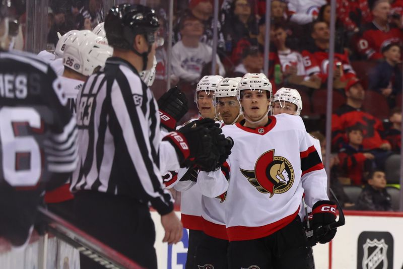 Mar 23, 2024; Newark, New Jersey, USA; Ottawa Senators center Ridly Greig (71) celebrates his goal against the New Jersey Devils during the second period at Prudential Center. Mandatory Credit: Ed Mulholland-USA TODAY Sports