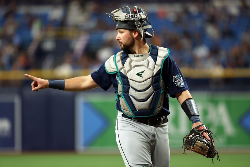 Sep 8, 2023; St. Petersburg, Florida, USA; Seattle Mariners catcher Cal Raleigh (29) calls a play against the Tampa Bay Rays during the first inning  at Tropicana Field. Mandatory Credit: Kim Klement Neitzel-USA TODAY Sports