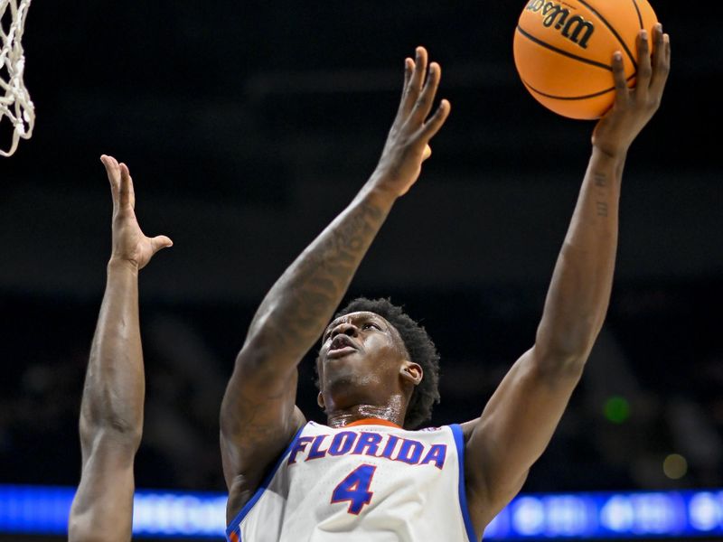 Mar 14, 2024; Nashville, TN, USA;  Florida Gators forward Tyrese Samuel (4) lays the ball up against the Georgia Bulldogs during the second half at Bridgestone Arena. Mandatory Credit: Steve Roberts-USA TODAY Sports