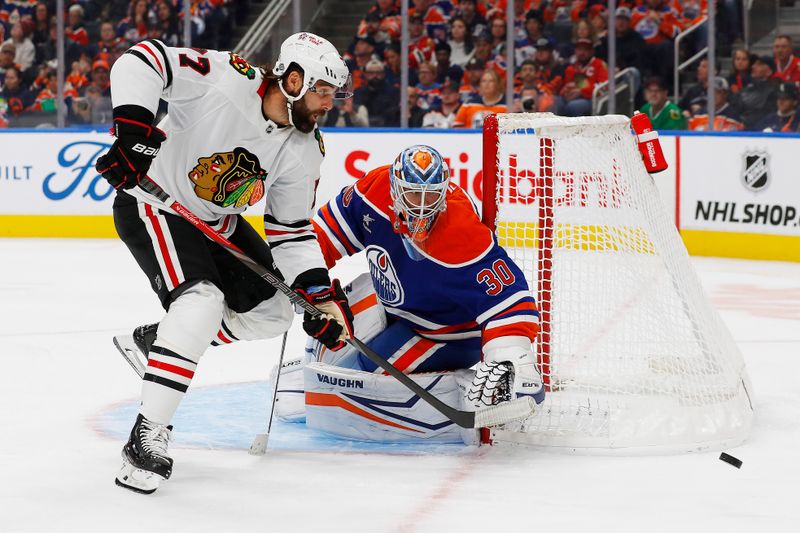 Oct 12, 2024; Edmonton, Alberta, CAN; Chicago Blackhawks forward Patrick Maroon (77) tries to get to a rebound beside Edmonton Oilers goaltender Calvin Pickard (30) during the second period at Rogers Place. Mandatory Credit: Perry Nelson-Imagn Images