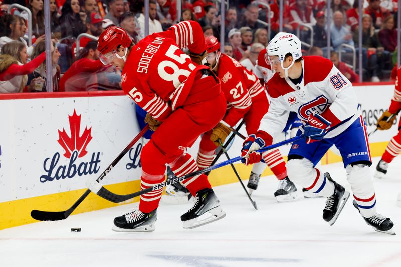 Oct 9, 2025; Detroit, Michigan, USA;  Detroit Red Wings left wing Elmer Soderblom (85) and Montréal Canadiens center Oliver Kapanen (91) battle for the puck in the second period at Little Caesars Arena. Mandatory Credit: Rick Osentoski-Imagn Images