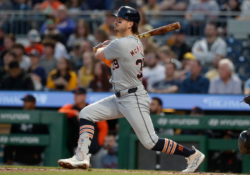 Apr 8, 2024; Pittsburgh, Pennsylvania, USA;  Detroit Tigers third baseman Zach McKinstry (39) drives in a run with a sacrifice fly against thePittsburgh Pirates during the fourth inning at PNC Park. Mandatory Credit: Charles LeClaire-USA TODAY Sports