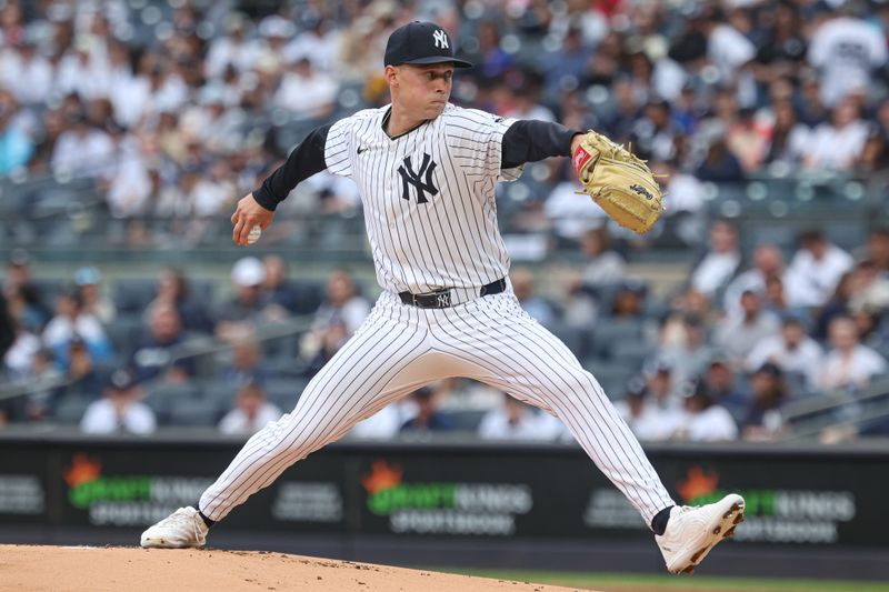 May 4, 2025; Bronx, New York, USA; New York Yankees starting pitcher Will Warren (98) delivers a pitch during the first inning against the Tampa Bay Rays at Yankee Stadium. Mandatory Credit: Vincent Carchietta-Imagn Images