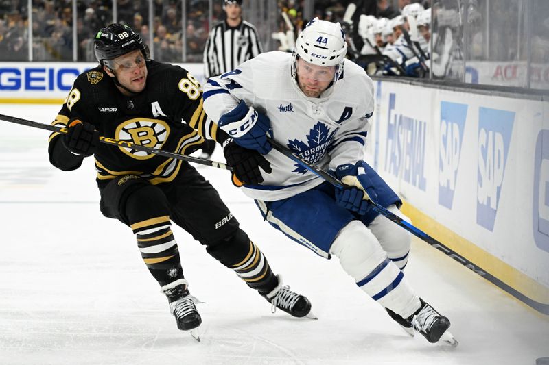 Apr 22, 2024; Boston, Massachusetts, USA; Toronto Maple Leafs defenseman Morgan Rielly (44) skates against Boston Bruins right wing David Pastrnak (88) during the second period in game two of the first round of the 2024 Stanley Cup Playoffs at TD Garden. Mandatory Credit: Brian Fluharty-USA TODAY Sports