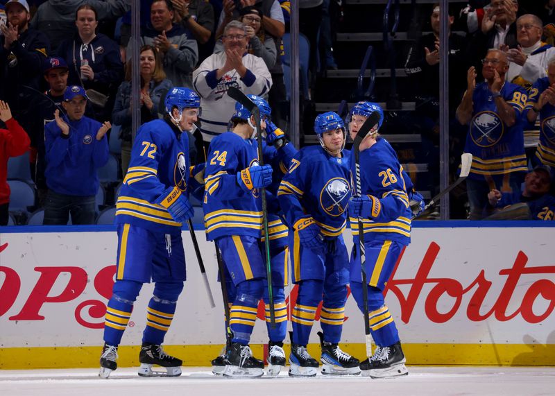 Nov 5, 2024; Buffalo, New York, USA;  Buffalo Sabres right wing JJ Peterka (77) celebrates his goal with teammates during the first period against the Ottawa Senators at KeyBank Center. Mandatory Credit: Timothy T. Ludwig-Imagn Images