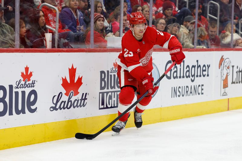 Dec 1, 2024; Detroit, Michigan, USA;  Detroit Red Wings left wing Lucas Raymond (23) skates with the puck in the second period against the Vancouver Canucks at Little Caesars Arena. Mandatory Credit: Rick Osentoski-Imagn Images