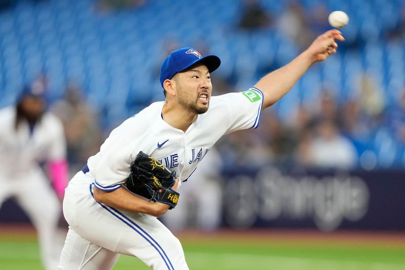 Sep 8, 2023; Toronto, Ontario, CAN; Toronto Blue Jays starting pitcher Yusei Kikuchi (16) pitches to the Kansas City Royals during the second inning at Rogers Centre. Mandatory Credit: John E. Sokolowski-USA TODAY Sports