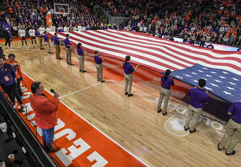 Jan 13, 2024; Clemson, South Carolina, USA; National Anthem with a large U.S. flag before the first half of a game between the Clemson Tigers and the Boston College Eagles at Littlejohn Coliseum. Mandatory Credit: Ken Ruinard-USA TODAY Sports