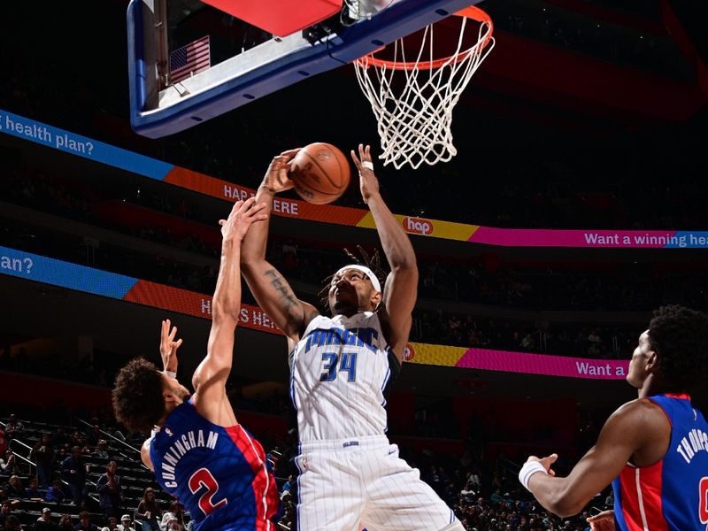 DETROIT, MI - FEBRUARY 4: Wendell Carter Jr. #34 of the Orlando Magic drives to the basket during the game  against the Detroit Pistons on February 4, 2024 at Little Caesars Arena in Detroit, Michigan. NOTE TO USER: User expressly acknowledges and agrees that, by downloading and/or using this photograph, User is consenting to the terms and conditions of the Getty Images License Agreement. Mandatory Copyright Notice: Copyright 2024 NBAE (Photo by Chris Schwegler/NBAE via Getty Images)