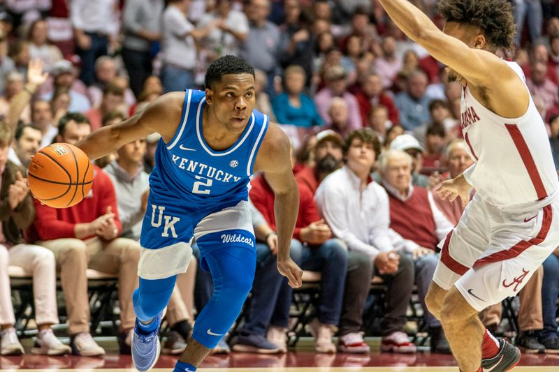 Jan 7, 2023; Tuscaloosa, Alabama, USA; Kentucky Wildcats guard Sahvir Wheeler (2) drives to the basket against Alabama Crimson Tide guard Mark Sears (1) during first half at Coleman Coliseum. Mandatory Credit: Marvin Gentry-USA TODAY Sports