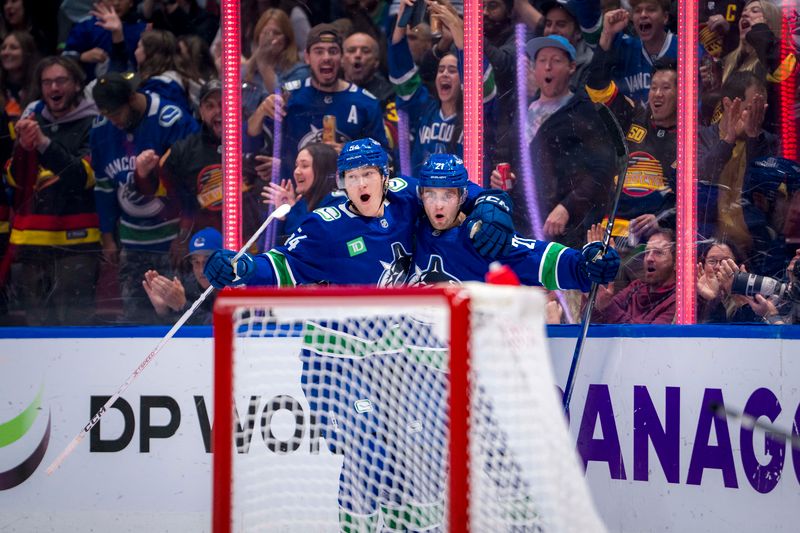 Oct 11, 2024; Vancouver, British Columbia, CAN; Vancouver Canucks forward Aatu Raty (54) and forward Nils Hoglander (21) celebrate Hoglander’s goal against the Philadelphia Flyers during the first period at Rogers Arena. Mandatory Credit: Bob Frid-Imagn Images