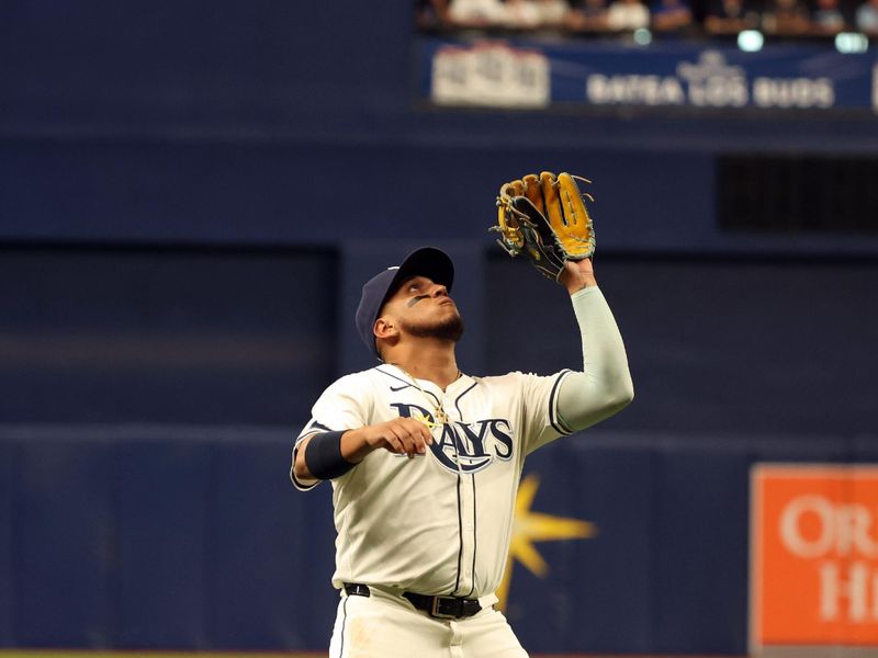 Apr 22, 2024; St. Petersburg, Florida, USA; Tampa Bay Rays third baseman Isaac Paredes (17) catches a fly ball against the Detroit Tigers during the first inning at Tropicana Field. Mandatory Credit: Kim Klement Neitzel-USA TODAY Sports