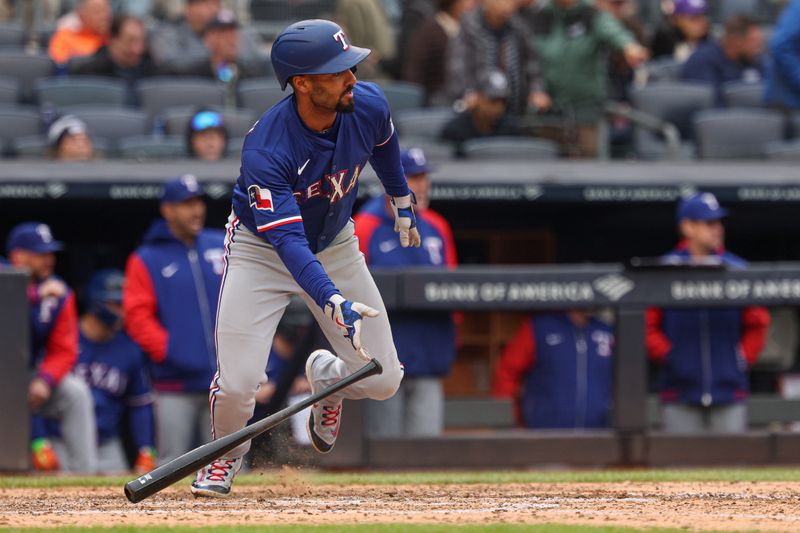 May 22, 2025; Bronx, New York, USA; Texas Rangers second baseman Marcus Semien (2) singles during the seventh inning against the New York Yankees at Yankee Stadium. Mandatory Credit: Vincent Carchietta-Imagn Images