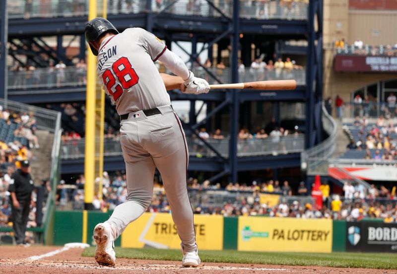 May 26, 2024; Pittsburgh, Pennsylvania, USA;  Atlanta Braves first baseman Matt Olson (28) hits a two run double against the Pittsburgh Pirates during the fifth inning at PNC Park. Atlanta won 8-1.Mandatory Credit: Charles LeClaire-USA TODAY Sports