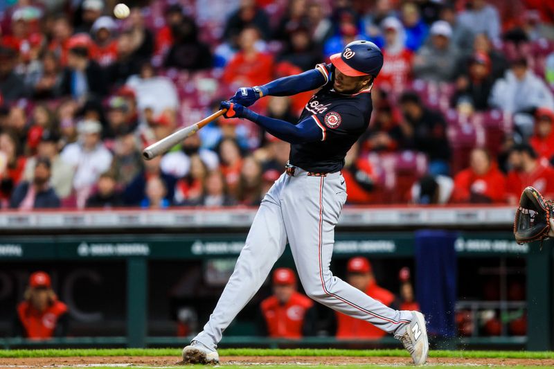 May 3, 2025; Cincinnati, Ohio, USA; Washington Nationals designated hitter James Wood (29) hits a double in the third inning against the Cincinnati Reds at Great American Ball Park. Mandatory Credit: Katie Stratman-Imagn Images