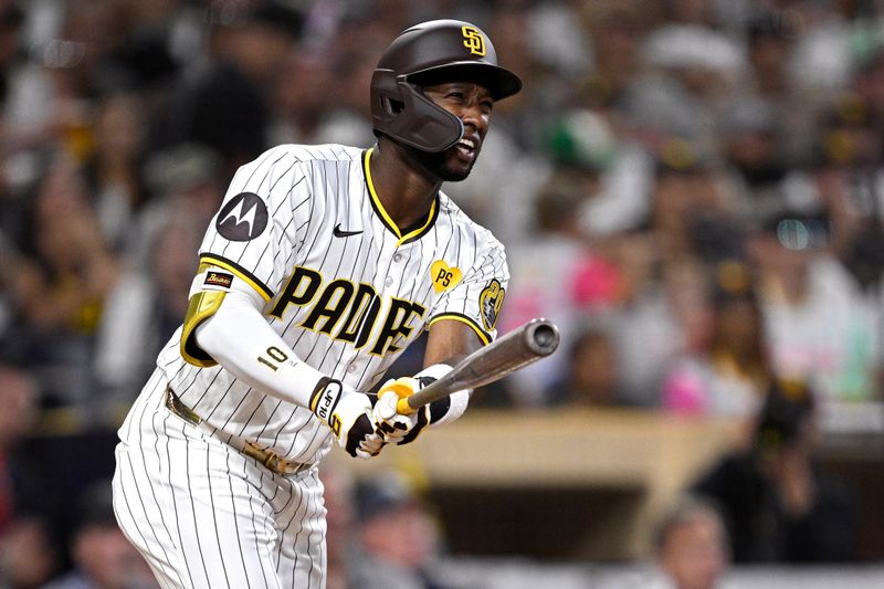 Jun 25, 2024; San Diego, California, USA; San Diego Padres left fielder Jurickson Profar (10) hits a grand slam home run against the Washington Nationals during the sixth inning at Petco Park. Mandatory Credit: Orlando Ramirez-USA TODAY Sports