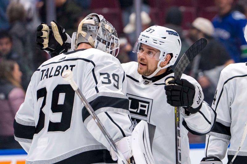 Mar 25, 2024; Vancouver, British Columbia, CAN; Los Angeles Kings goalie Cam Talbot (39) and forward Viktor Arvidsson (33) celebrate their victory against the Vancouver Canucks at Rogers Arena. Kings won 3 -2. Mandatory Credit: Bob Frid-USA TODAY Sports