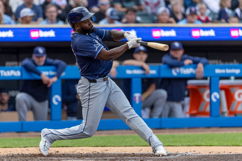 Jun 19, 2024; Minneapolis, Minnesota, USA; Tampa Bay Rays left fielder Randy Arozarena (56) hits a double against the Minnesota Twins in the fourth inning at Target Field. Mandatory Credit: Jesse Johnson-USA TODAY Sports