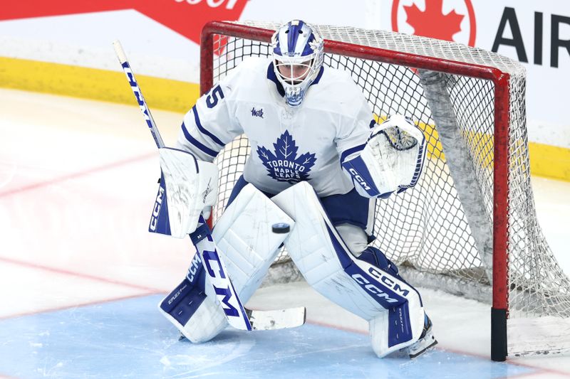 Jan 17, 2026; Winnipeg, Manitoba, CAN; Toronto Maple Leafs goaltender Dennis Hildeby (35) warms up before a game against the Winnipeg Jets at Canada Life Centre. Mandatory Credit: James Carey Lauder-Imagn Images