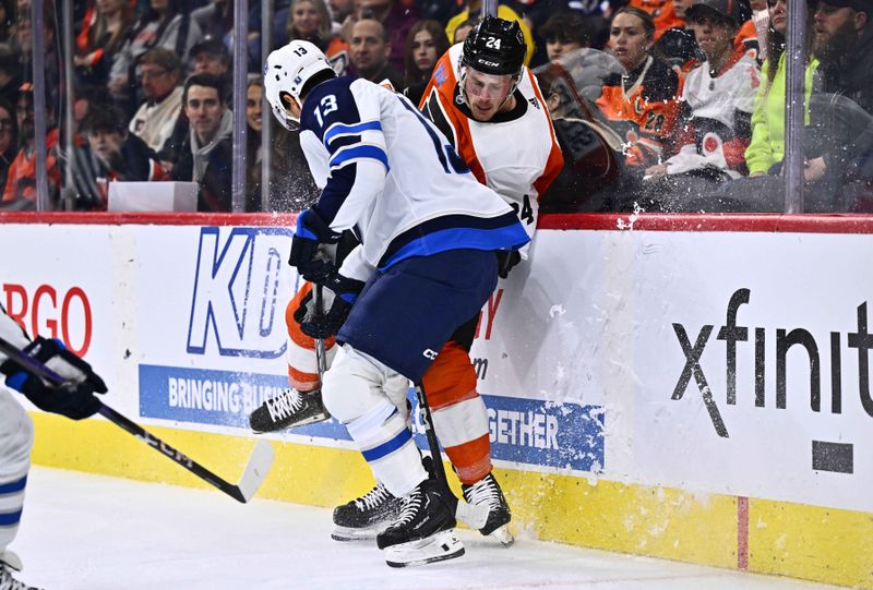 Feb 8, 2024; Philadelphia, Pennsylvania, USA; Winnipeg Jets center Gabriel Vilardi (13) hits Philadelphia Flyers defenseman Nick Seeler (24) in the second period at Wells Fargo Center. Mandatory Credit: Kyle Ross-USA TODAY Sports