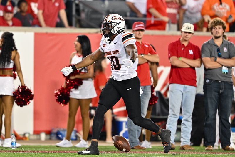 Nov 18, 2023; Houston, Texas, USA; Oklahoma State Cowboys wide receiver Rashod Owens (10) reacts after a play during the fourth quarter against the Houston Cougars at TDECU Stadium. Mandatory Credit: Maria Lysaker-USA TODAY Sports