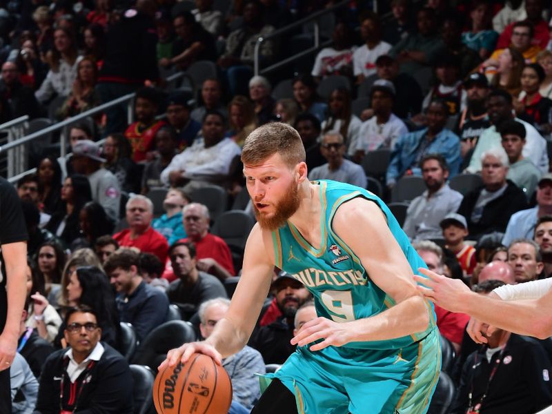 ATLANTA, GA - MARCH 23: Davis Bertans #9 of the Charlotte Hornets dribbles the ball during the game against the Atlanta Hawks on March 23, 2024 at State Farm Arena in Atlanta, Georgia.  NOTE TO USER: User expressly acknowledges and agrees that, by downloading and/or using this Photograph, user is consenting to the terms and conditions of the Getty Images License Agreement. Mandatory Copyright Notice: Copyright 2024 NBAE (Photo by Scott Cunningham/NBAE via Getty Images)