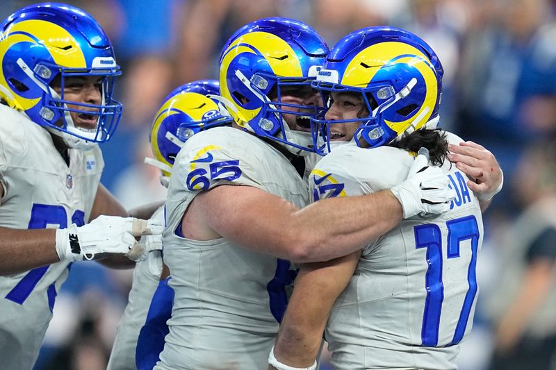 Los Angeles Rams wide receiver Puka Nacua, right, celebrates with teammates after scoring a touchdown during overtime in an NFL football game against the Indianapolis Colts, Sunday, Oct. 1, 2023, in Indianapolis. (AP Photo/Darron Cummings)