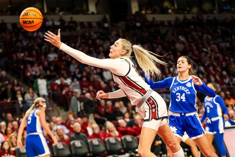 Jan 15, 2024; Columbia, South Carolina, USA; South Carolina Gamecocks forward Chloe Kitts (21) reaches for a pass against the Kentucky Wildcats  in the first half at Colonial Life Arena. Mandatory Credit: Jeff Blake-USA TODAY Sports