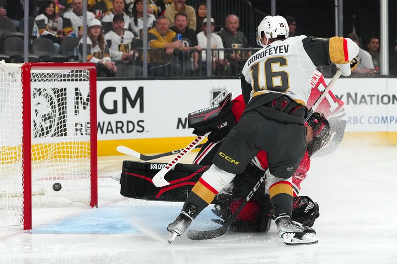 Oct 27, 2023; Las Vegas, Nevada, USA; Vegas Golden Knights left wing Pavel Dorofeyev (16) scores a goal against Chicago Blackhawks goaltender Petr Mrazek (34) during the first period at T-Mobile Arena. Mandatory Credit: Stephen R. Sylvanie-USA TODAY Sports