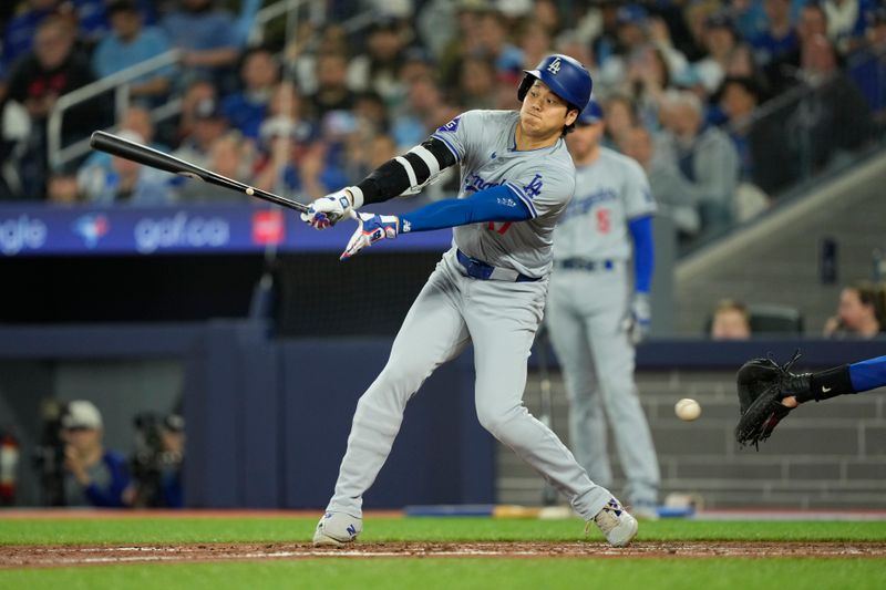 Apr 27, 2024; Toronto, Ontario, CAN; Los Angeles Dodgers designated hitter Shohei Ohtani (17) strikes out against the Toronto Blue Jays during the fourth inning at Rogers Centre. Mandatory Credit: John E. Sokolowski-USA TODAY Sports