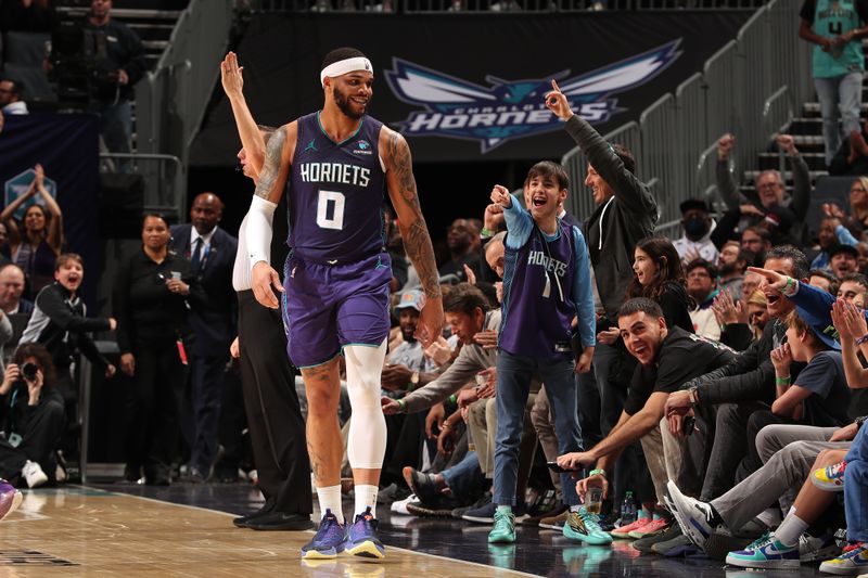 CHARLOTTE, NC - JANUARY 19: Miles Bridges #0 of the Charlotte Hornets reacts after making a shot as time expired in the fist half during the game against the San Antonio Spurs on January 19, 2024 at Spectrum Center in Charlotte, North Carolina. NOTE TO USER: User expressly acknowledges and agrees that, by downloading and or using this photograph, User is consenting to the terms and conditions of the Getty Images License Agreement. Mandatory Copyright Notice: Copyright 2024 NBAE (Photo by Kent Smith/NBAE via Getty Images)