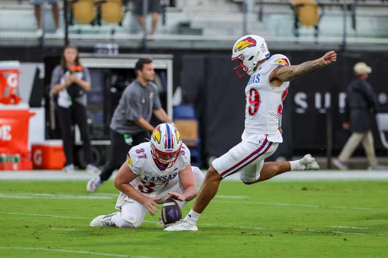 Oct 4, 2025; Orlando, Florida, USA; Kansas Jayhawks kicker Laith Marjan (99) warms up before the game against the UCF Knights at FBC Mortgage Stadium. Mandatory Credit: Mike Watters-Imagn Images