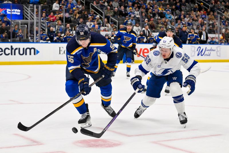 Nov 5, 2024; St. Louis, Missouri, USA;  St. Louis Blues defenseman Colton Parayko (55) and Tampa Bay Lightning center Jake Guentzel (59) battle for the puck during the third period at Enterprise Center. Mandatory Credit: Jeff Curry-Imagn Images