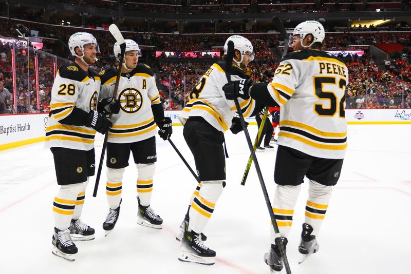 Oct 8, 2024; Sunrise, Florida, USA; Boston Bruins center Pavel Zacha (18) celebrates with teammates after scoring against the Florida Panthers during the first period at Amerant Bank Arena. Mandatory Credit: Sam Navarro-Imagn Images