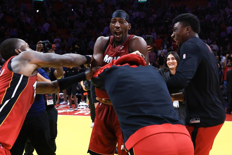 MIAMI, FLORIDA - NOVEMBER 29: Bam Adebayo #13 of the Miami Heat celebrates with teammates after defeating the reacts in the Emirates NBA Cup at Kaseya Center on November 29, 2024 in Miami, Florida. NOTE TO USER: User expressly acknowledges and agrees that, by downloading and or using this photograph, User is consenting to the terms and conditions of the Getty Images License Agreement. (Photo by Megan Briggs/Getty Images)