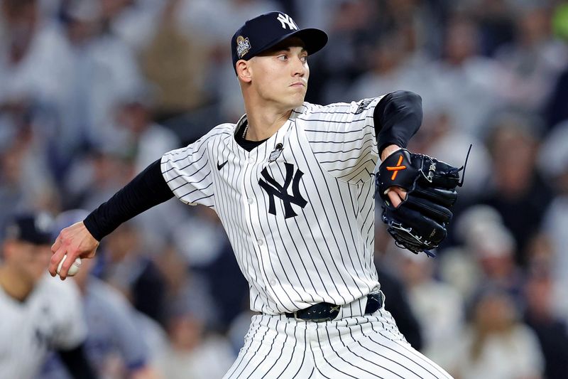 Oct 30, 2024; New York, New York, USA; New York Yankees pitcher Luke Weaver (30) pitches during the eighth inning against the Los Angeles Dodgers in game four of the 2024 MLB World Series at Yankee Stadium. Mandatory Credit: Brad Penner-Imagn Images