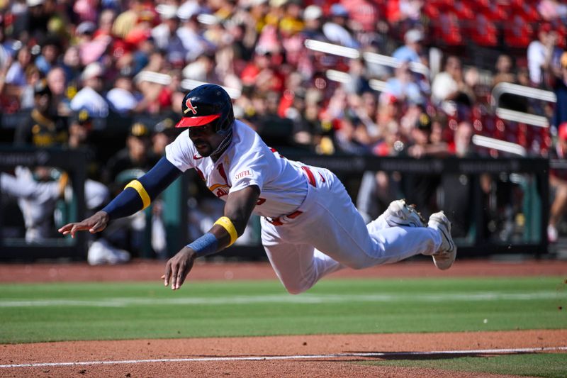 Sep 3, 2023; St. Louis, Missouri, USA;  St. Louis Cardinals right fielder Jordan Walker (18) dives as he slides head first in at home plate against the Pittsburgh Pirates during the seventh inning at Busch Stadium. Mandatory Credit: Jeff Curry-USA TODAY Sports